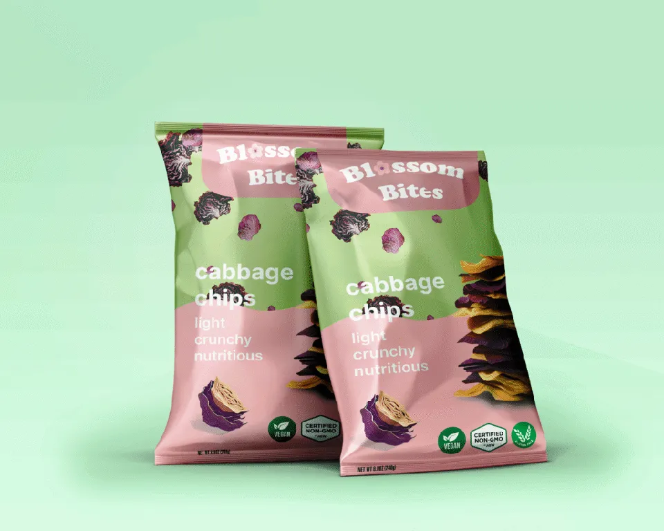 Two Blossom Bites snack bags displayed against a pale green background.