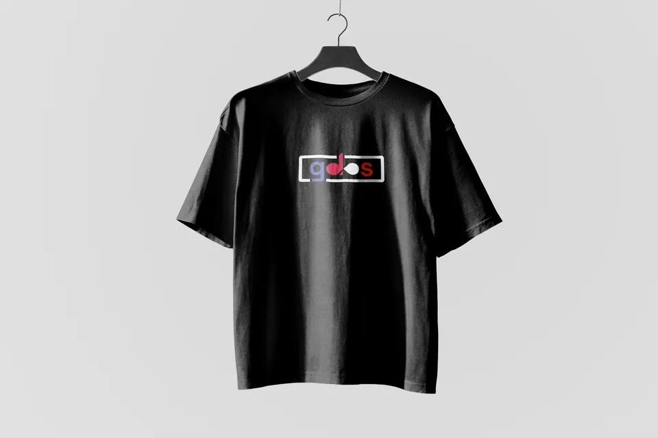 Black T-shirt on a hanger with the framed gdos logo printed on the chest.