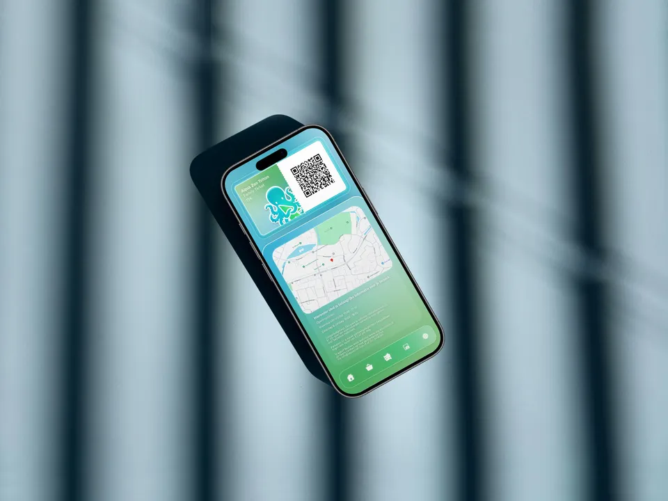 A phone showing the Aqua Zoo Triton ticket with a QR code and a map, lying on a striped blue surface.